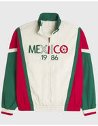 Cream-colored jacket with green and red accents featuring 'MEXICO 1986' text and soccer ball graphic.