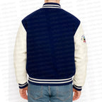 Navy and white varsity jacket with 'urban collections' branding on a white background