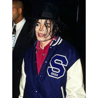 Person wearing a blue letterman jacket with a large 'S' and 'Sega' logo, standing next to another person.