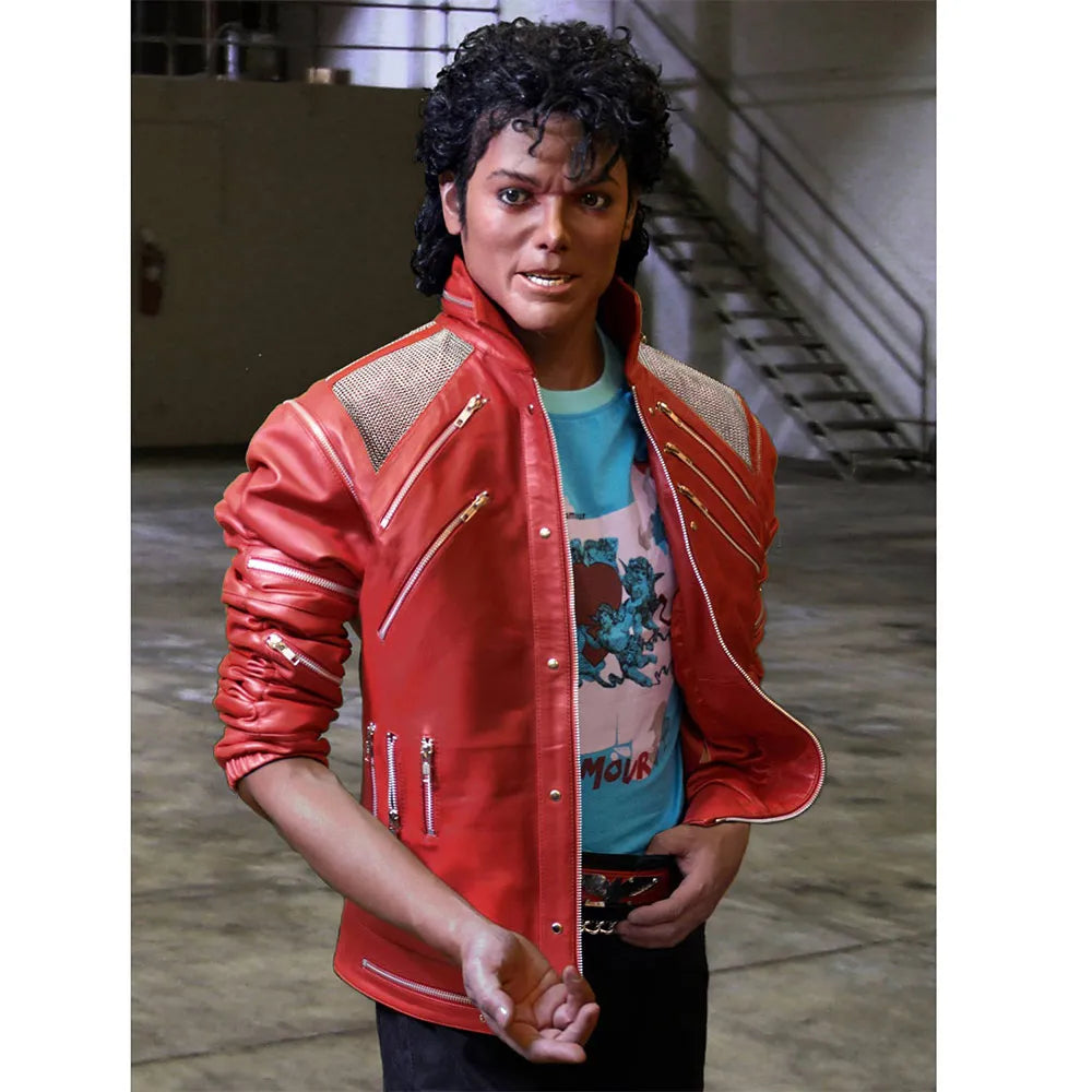 Person wearing a red jacket with zippers, standing indoors.