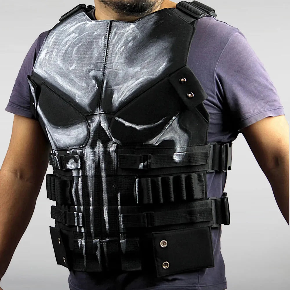 Person wearing a tactical vest with a skull design on a plain background