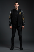 Male model wearing Demon Slayer Premium Varsity Jacket