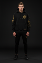 Male model wearing Demon Slayer Gold Hoodie